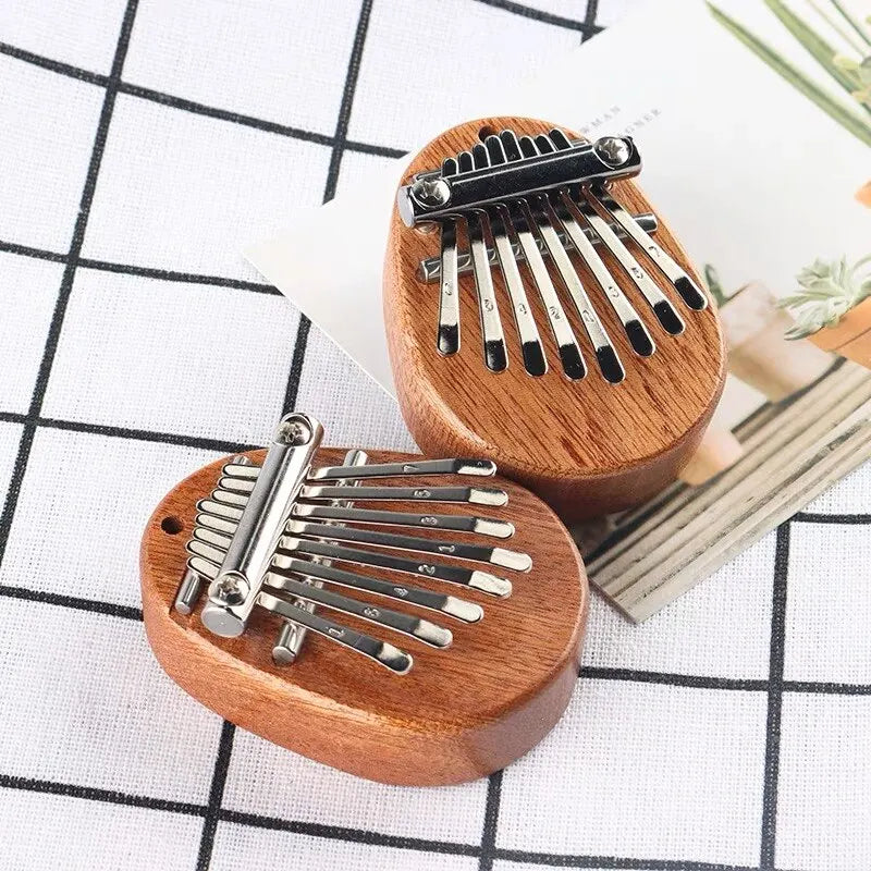 Wooden Mini Thumb Piano: Portable Musical Toy with 8 Tones - Perfect for Beginners