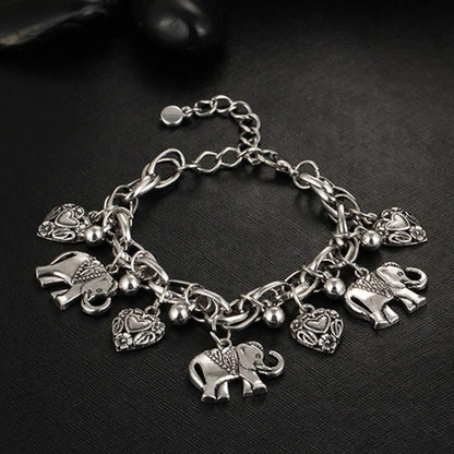 Vintage Women's Bracelet with Carved Heart and Elephant Pendant - Unique Shiny Bangle