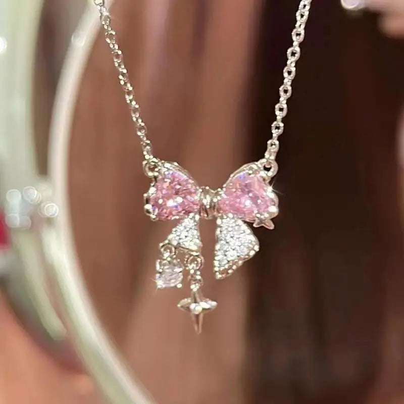 Korea Bowknot Pink Zircon Cross Pendant Necklace – Fashionable Clavicle Chain for Women, Trendy Party Jewelry